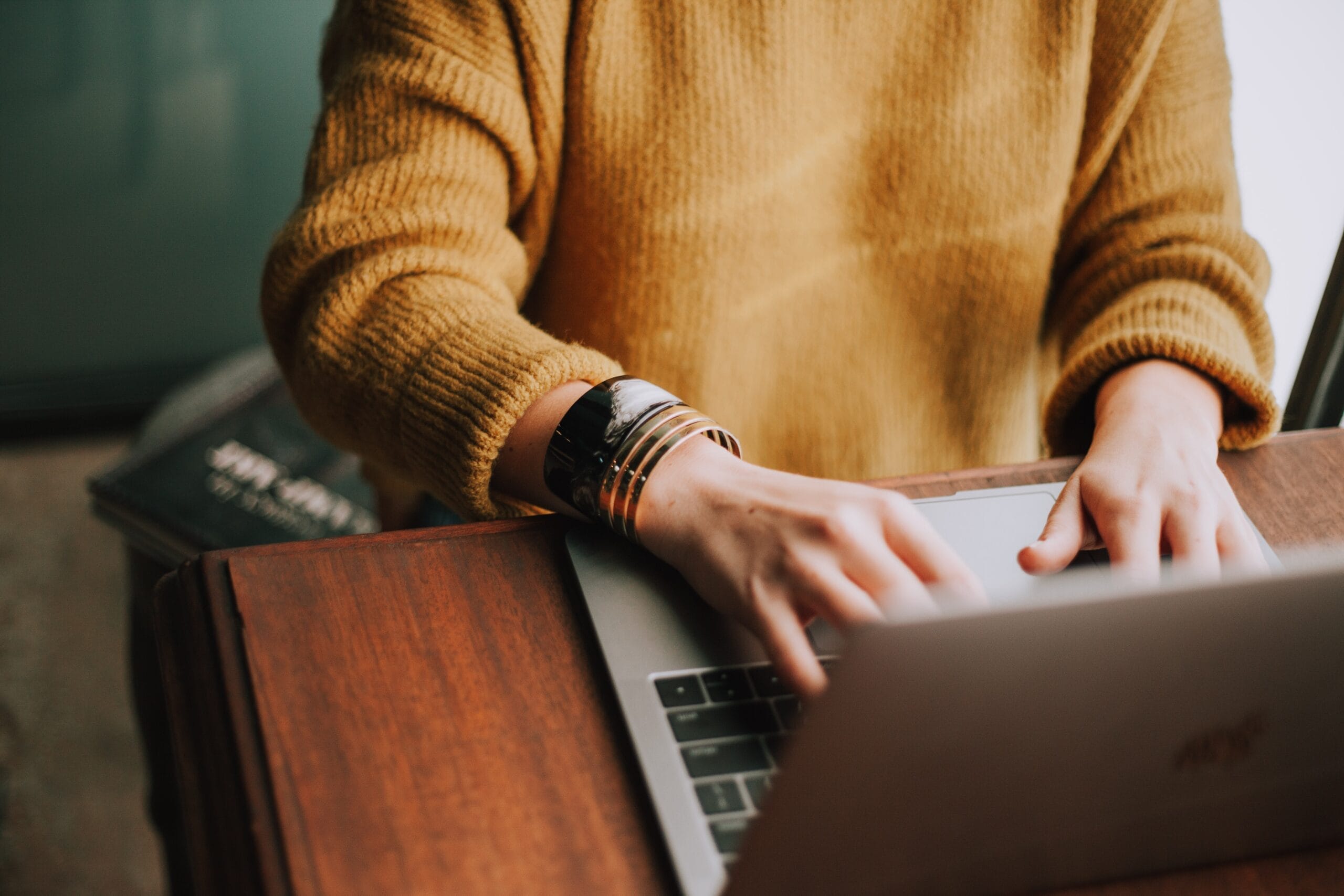 person hiring on a laptop