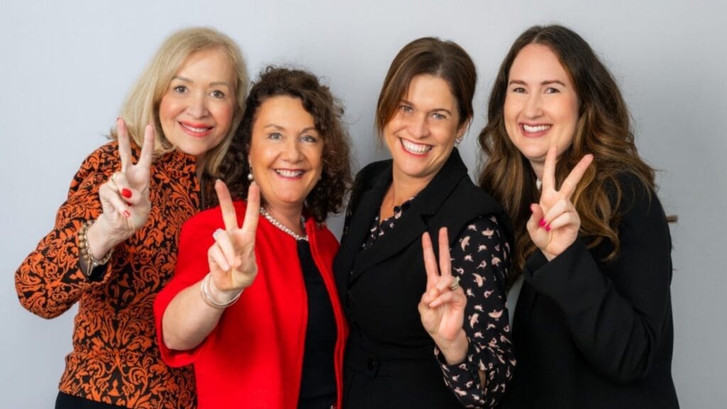 Women team members posing together