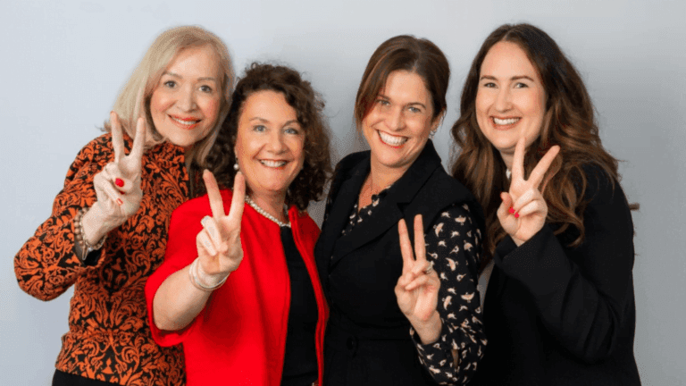 Women team members posing together