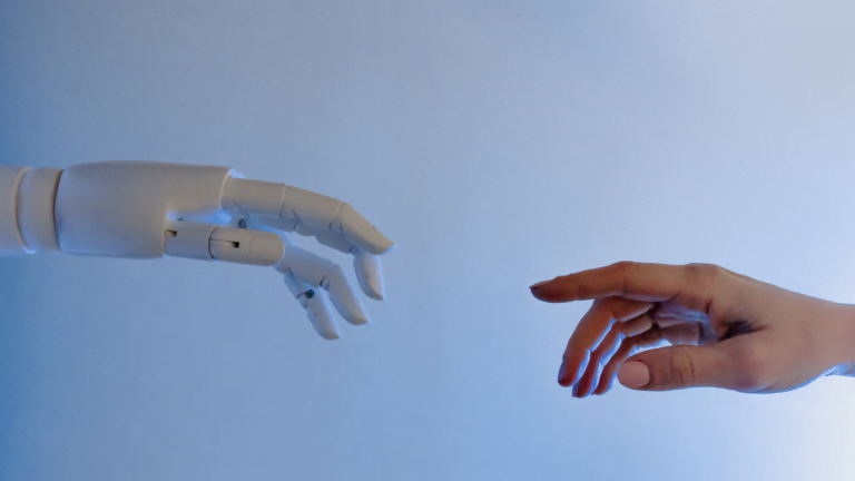 AI and human hand representing the impact of technology in executive recruitment Brisbane