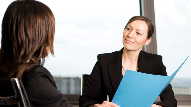 Person being made redundant and manager offering outplacement services Australia
