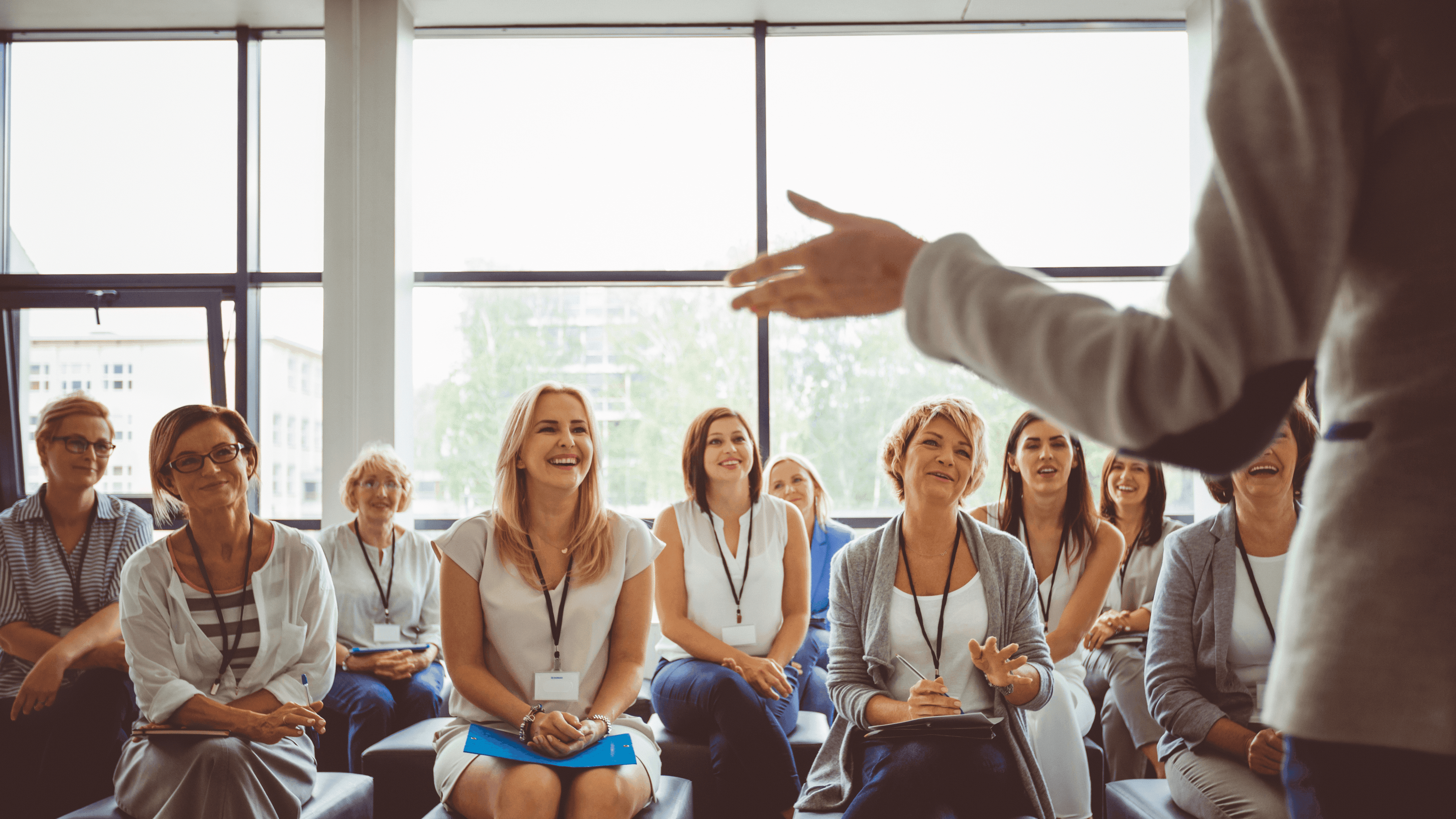 Leadership development conveyed by a leader presenting to audience.