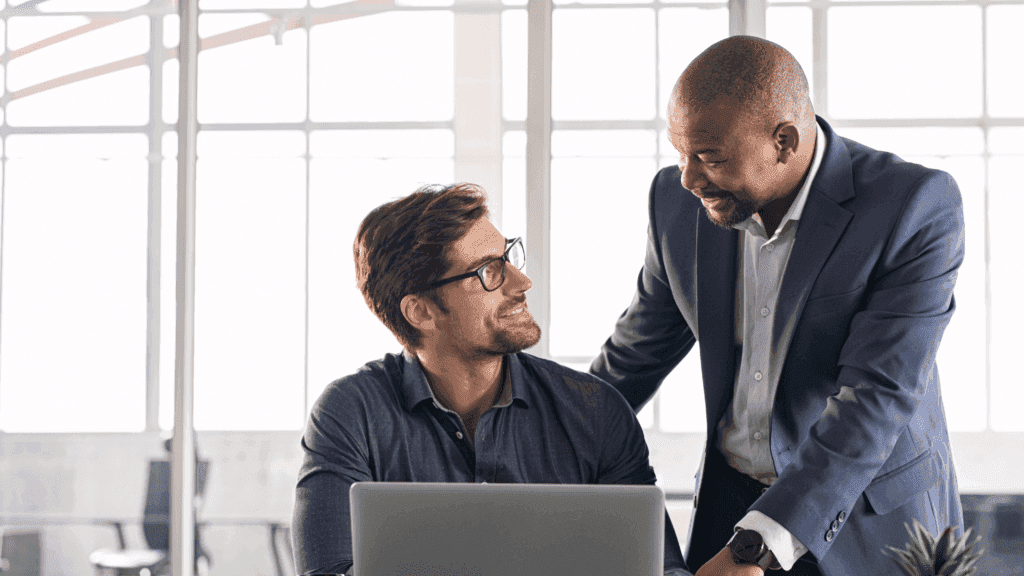 Leader checking on employee as part of talent management
