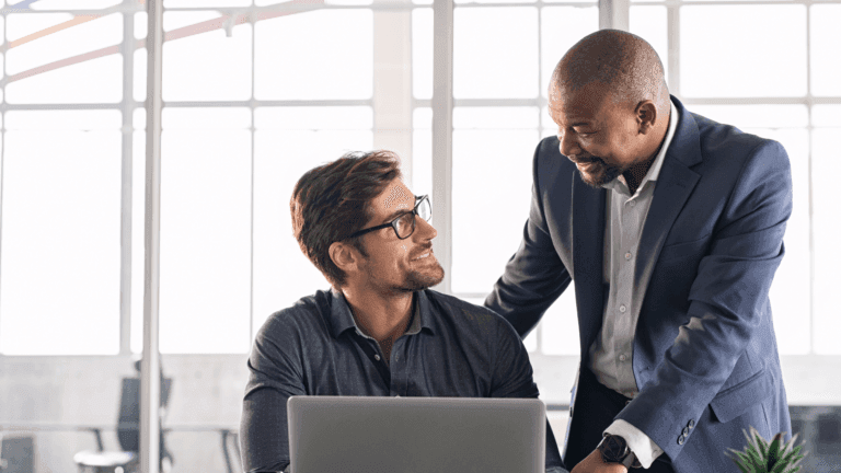 Leader checking on employee as part of talent management
